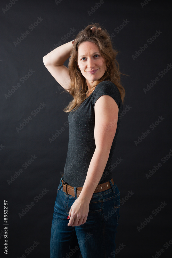 Beautiful woman doing different expressions in different sets of clothes: hands in hair Beautiful woman doing different expressions in different sets of clothes: hands in hair
