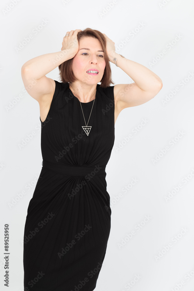 Fototapeta premium Beautiful woman doing different expressions in different sets of clothes: headache
