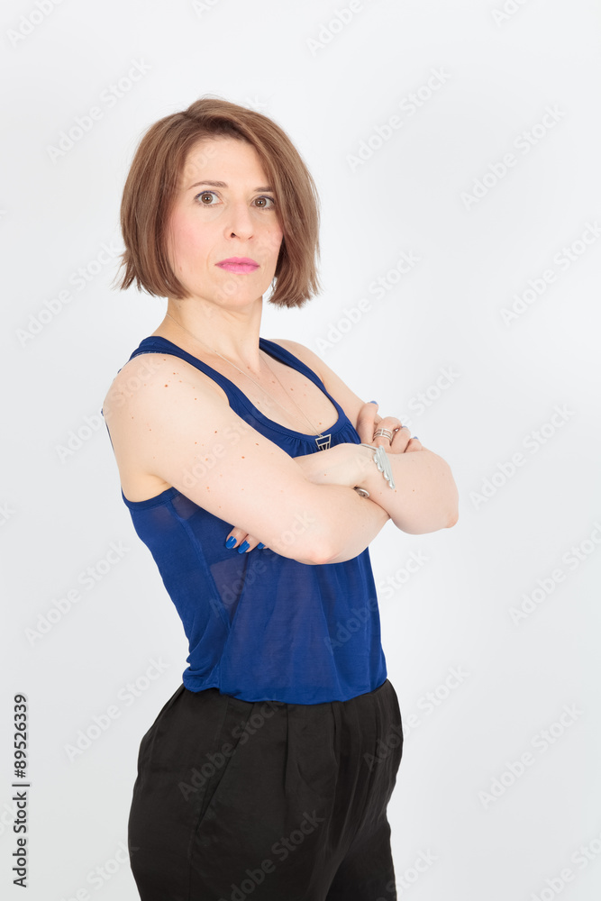 Beautiful woman doing different expressions in different sets of clothes: arms crossed Beautiful woman doing different expressions in different sets of clothes: arms crossed