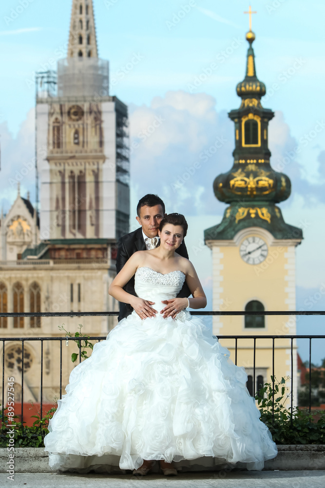 Bride and groom posing in city Bride and groom posing in city