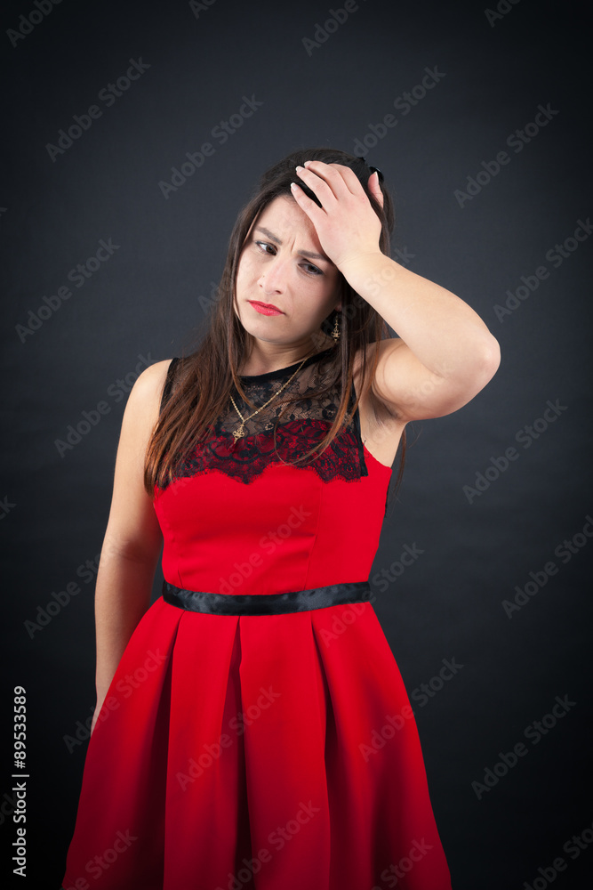 Beautiful woman doing different expressions in different sets of clothes: headache Beautiful woman doing different expressions in different sets of clothes: headache