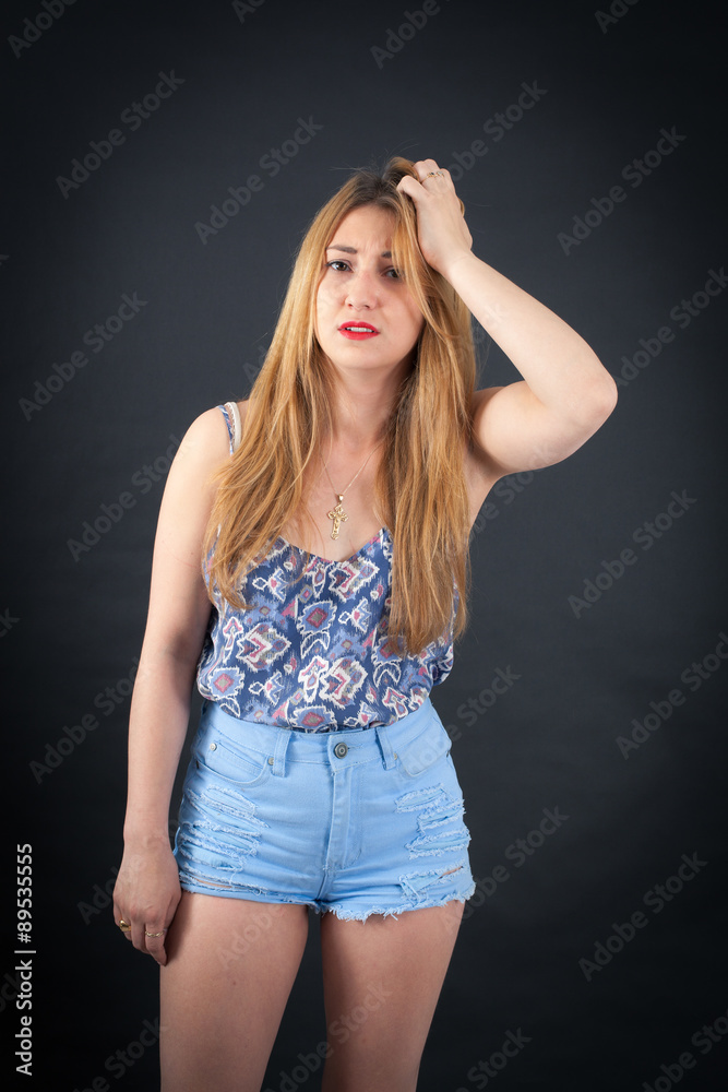 Beautiful girl doing different expressions in different sets of clothes: headache Beautiful girl doing different expressions in different sets of clothes: headache