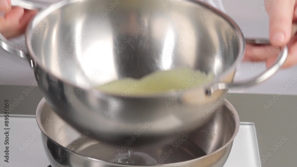 Eggs being beaten in a bain marie Eggs being beaten in a bain marie