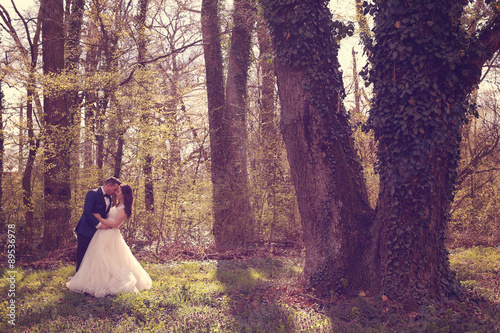 Bride and groom in a beautiful forest