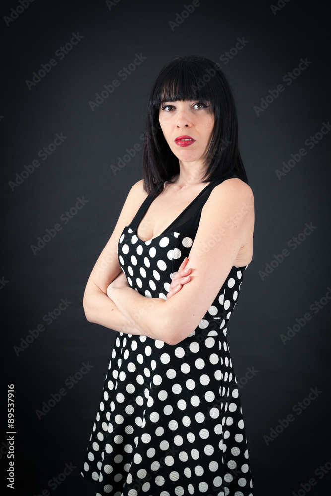 Beautiful woman doing different expressions in different sets of clothes: arms crossed Beautiful woman doing different expressions in different sets of clothes: arms crossed