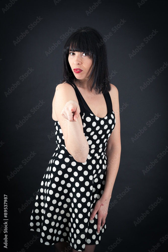 Beautiful woman doing different expressions in different sets of clothes: pointing Beautiful woman doing different expressions in different sets of clothes: pointing