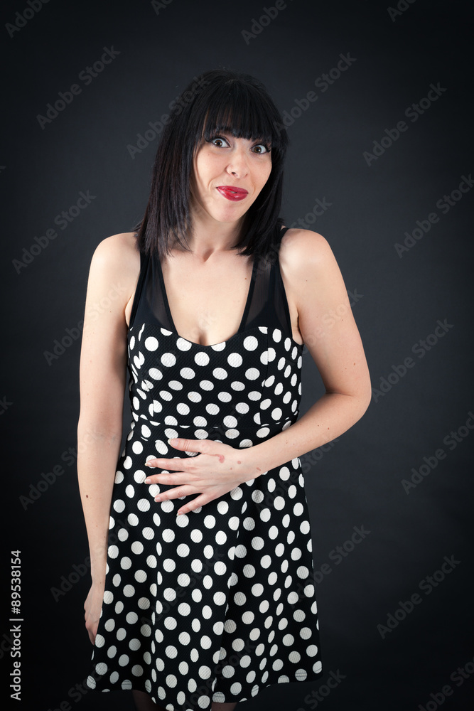 Beautiful woman doing different expressions in different sets of clothes: hungry Beautiful woman doing different expressions in different sets of clothes: hungry