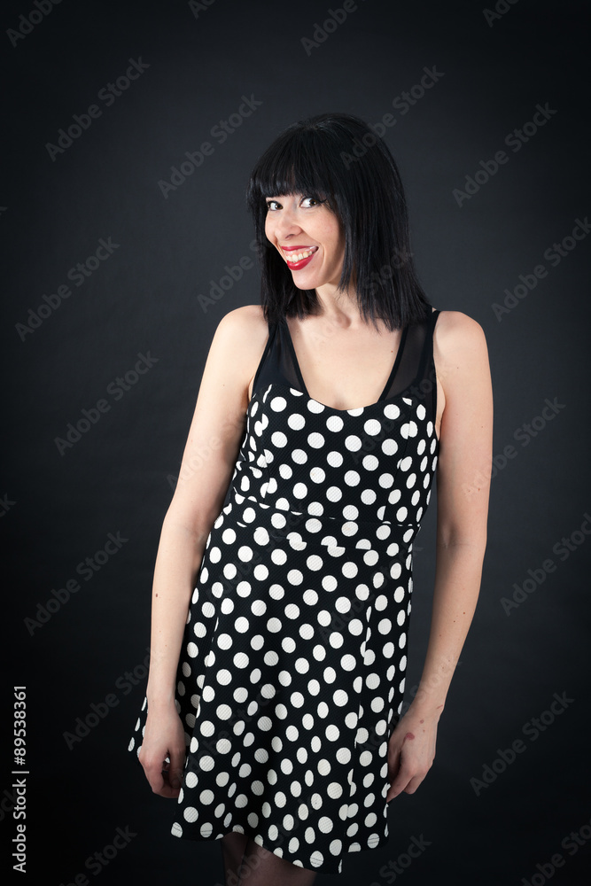 Naklejka premium Beautiful woman doing different expressions in different sets of clothes: smile