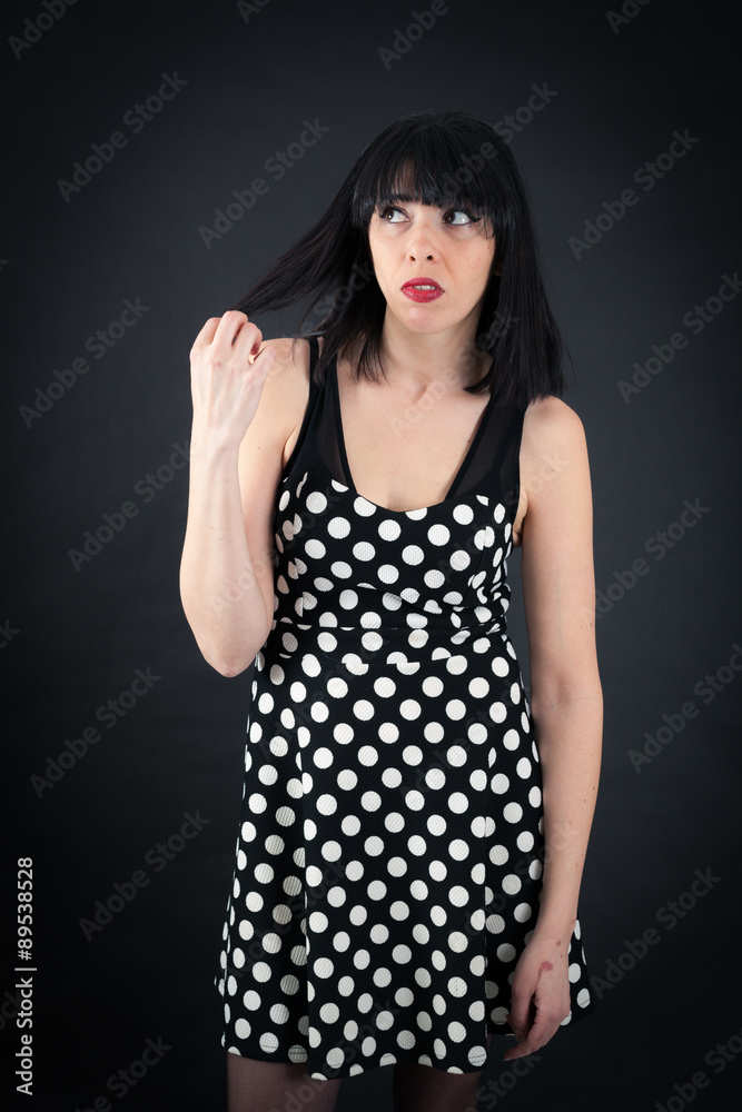 Beautiful woman doing different expressions in different sets of clothes: bored Beautiful woman doing different expressions in different sets of clothes: bored