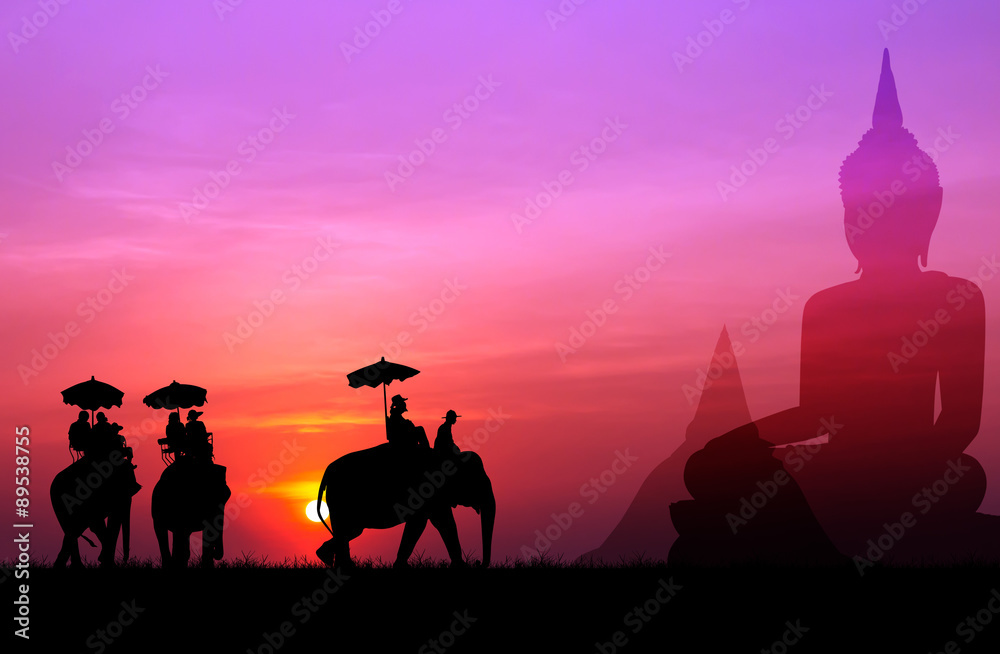 silhouette elephant with tourist with big buddha and pagada back