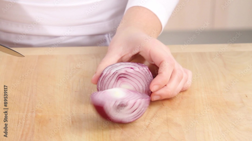 A red onion being sliced