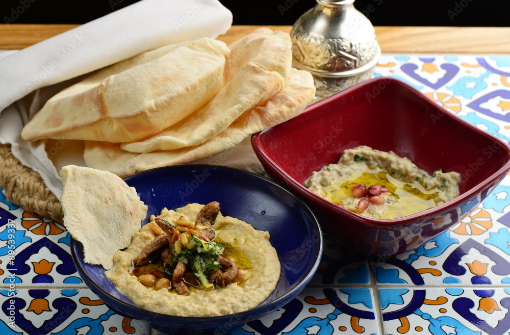 Baba ganoush and Hummus, arabian appetizer from tahini and baked eggplant, excellent dip for meat or separately only to the Arab bread Baba ganoush and Hummus, arabian appetizer from tahini and baked eggplant, excellent dip for meat or separately only to the Arab bread