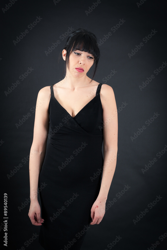 Beautiful woman doing different expressions in different sets of clothes: sad Beautiful woman doing different expressions in different sets of clothes: sad