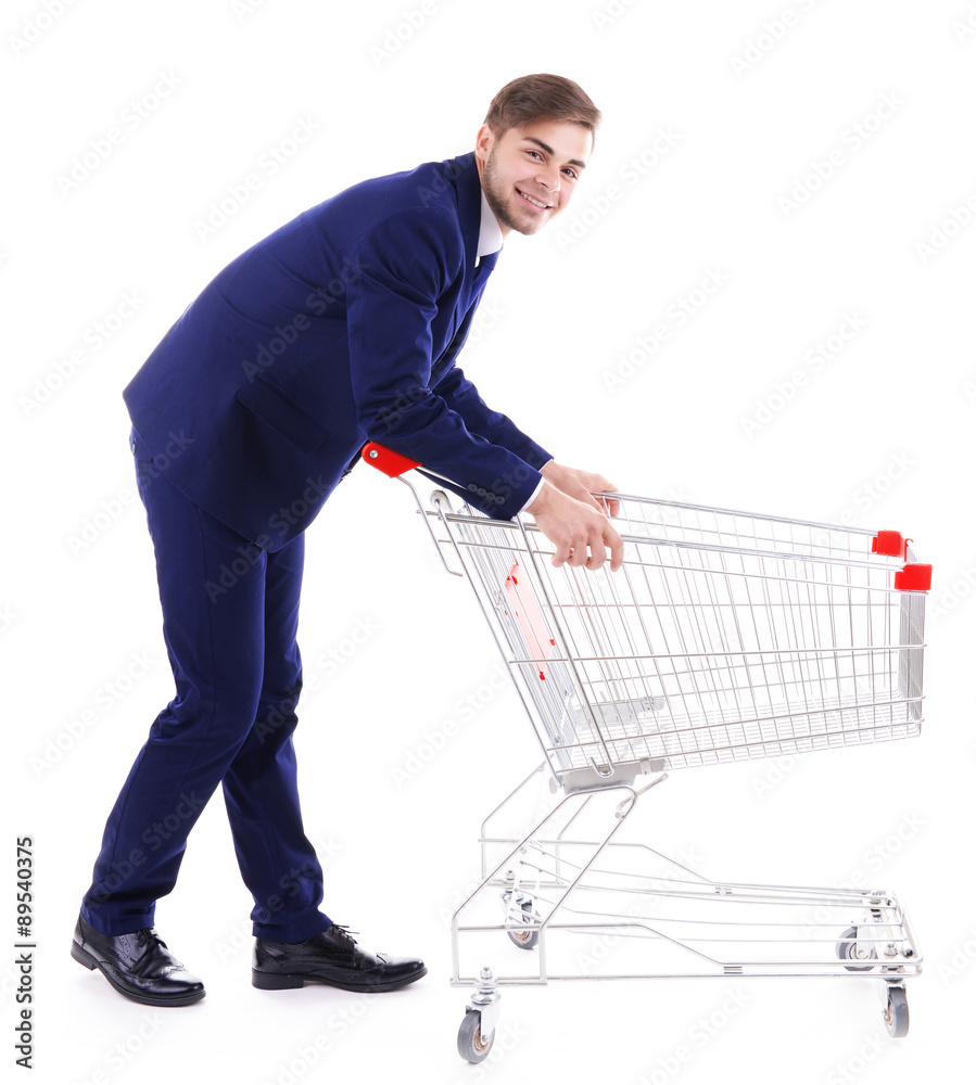 Young man with empty shopping cart, isolated on white Young man with empty shopping cart, isolated on white