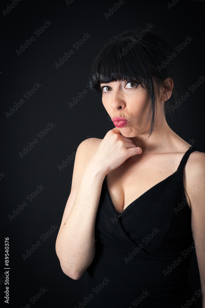 Fototapeta premium Beautiful woman doing different expressions in different sets of clothes: