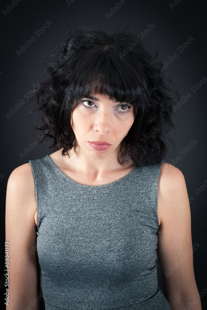 Beautiful woman doing different expressions in different sets of clothes: sad Beautiful woman doing different expressions in different sets of clothes: sad