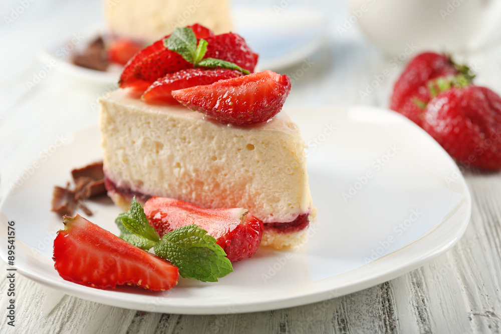 Delicious cheesecake with berries on table close up Delicious cheesecake with berries on table close up