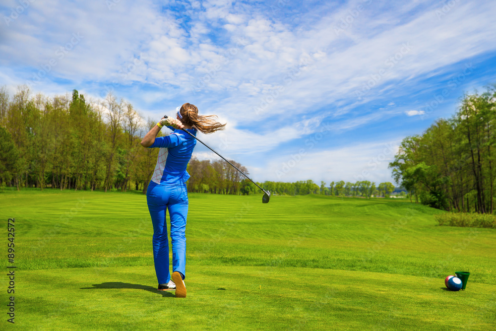 Woman playing golf