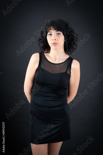 Beautiful woman doing different expressions in different sets of clothes: posing