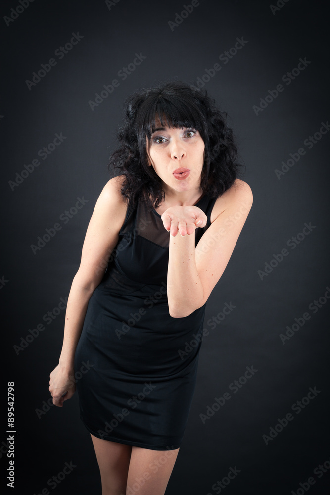 Beautiful woman doing different expressions in different sets of clothes: kiss