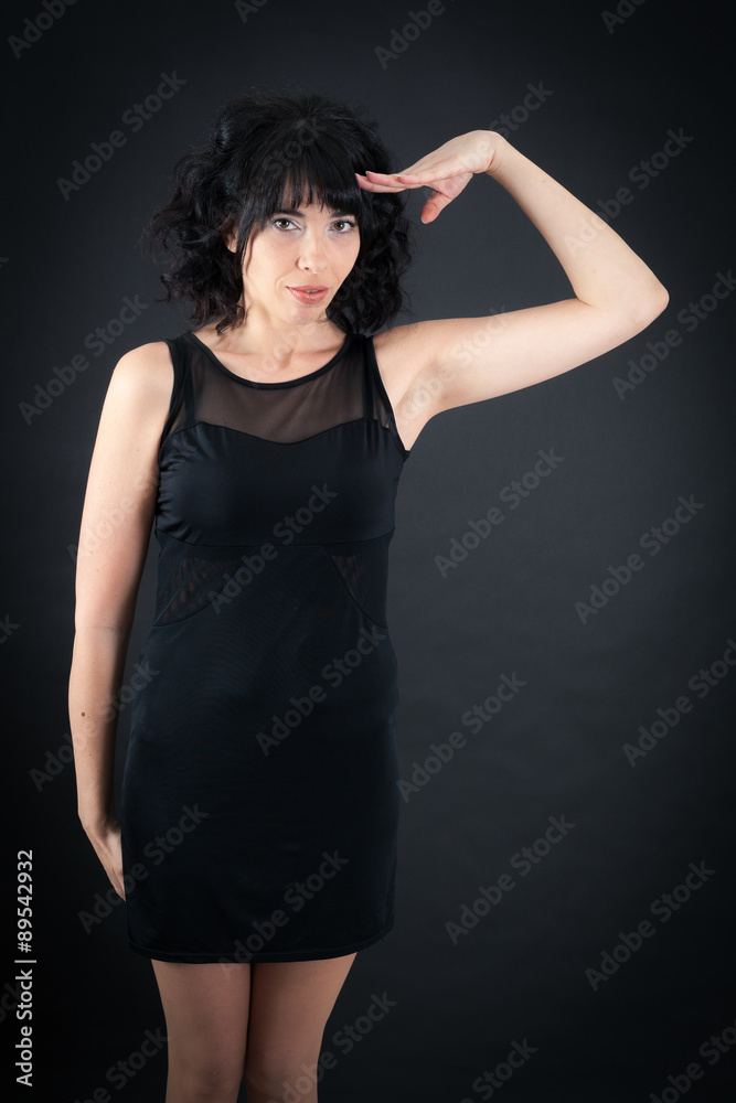 Beautiful woman doing different expressions in different sets of clothes: at attention Beautiful woman doing different expressions in different sets of clothes: at attention