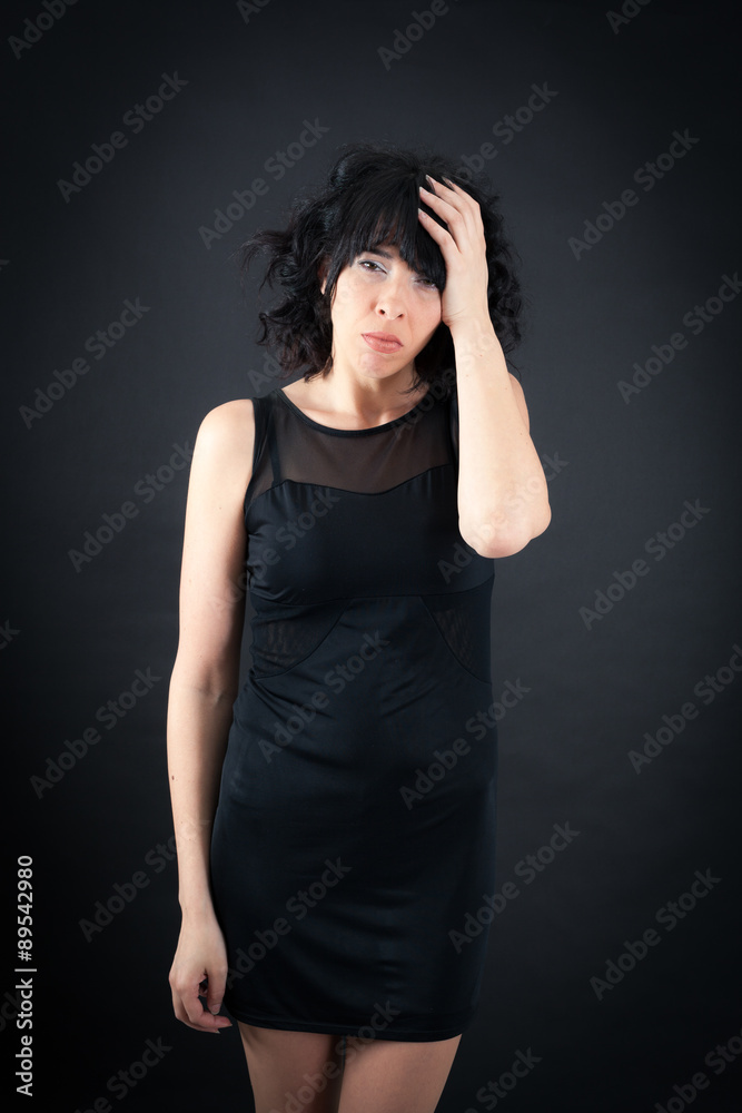 Beautiful woman doing different expressions in different sets of clothes: headache