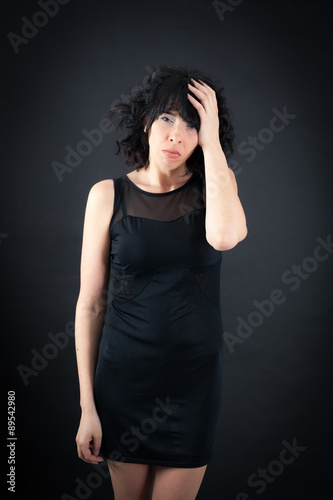 Beautiful woman doing different expressions in different sets of clothes: headache