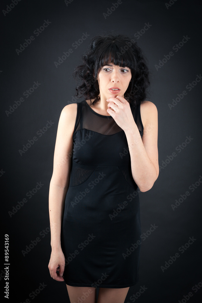 Beautiful woman doing different expressions in different sets of clothes: worried Beautiful woman doing different expressions in different sets of clothes: worried