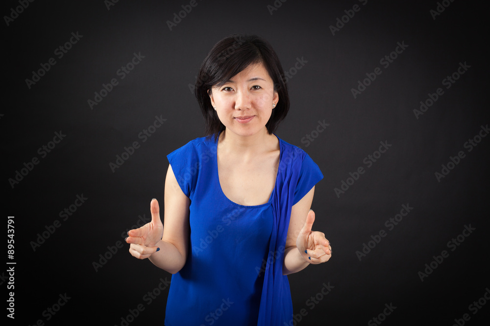 Beautiful woman doing different expressions in different sets of clothes: gun sign Beautiful woman doing different expressions in different sets of clothes: gun sign