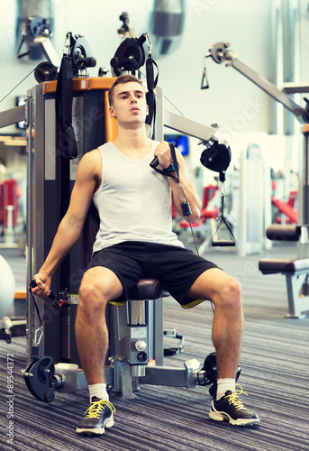 man exercising on gym machine