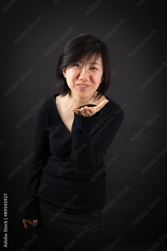 Beautiful woman doing different expressions in different sets of clothes: kiss Beautiful woman doing different expressions in different sets of clothes: kiss