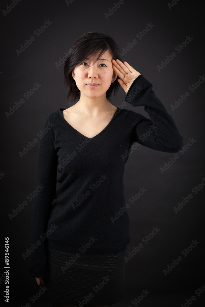 Beautiful woman doing different expressions in different sets of clothes: at attention Beautiful woman doing different expressions in different sets of clothes: at attention
