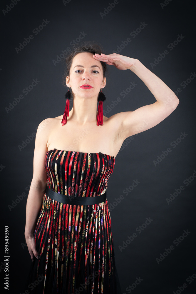Beautiful woman doing different expressions in different sets of clothes: at attention Beautiful woman doing different expressions in different sets of clothes: at attention