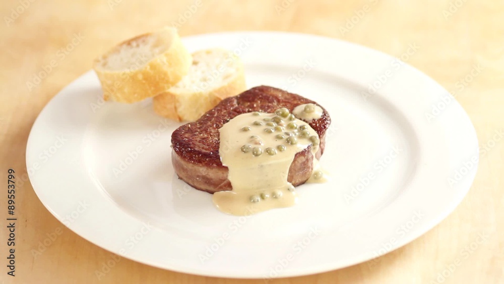 Arranging fillet steak with pepper sauce Arranging fillet steak with pepper sauce