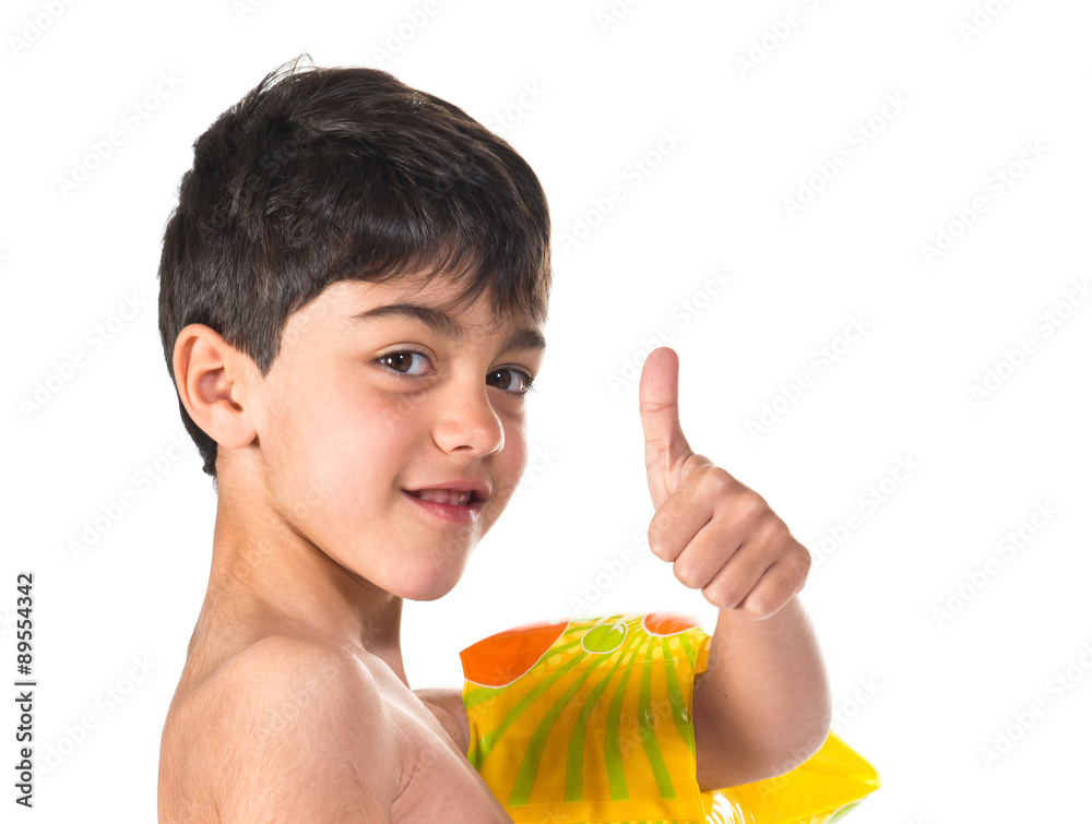 Boy in swimsuit making ok gesture Boy in swimsuit making ok gesture