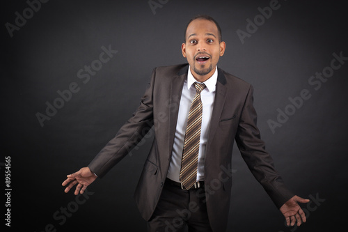 Slika na platnu Handsome man doing different expressions in different sets of clothes: surprise