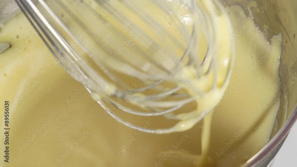 Beating Hollandaise sauce until creamy Beating Hollandaise sauce until creamy