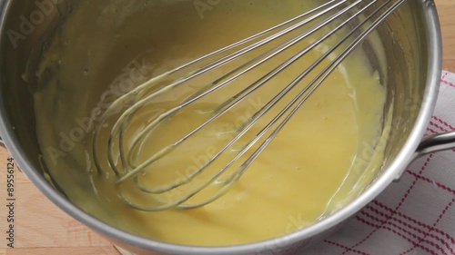Hollandaise sauce in a mixing bowl