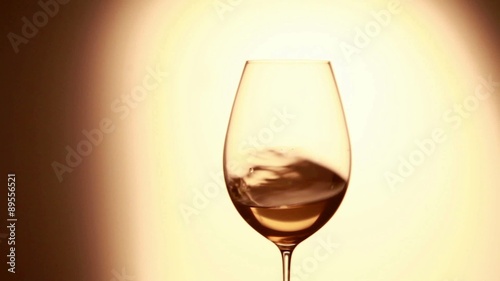 White wine swirling in a glass