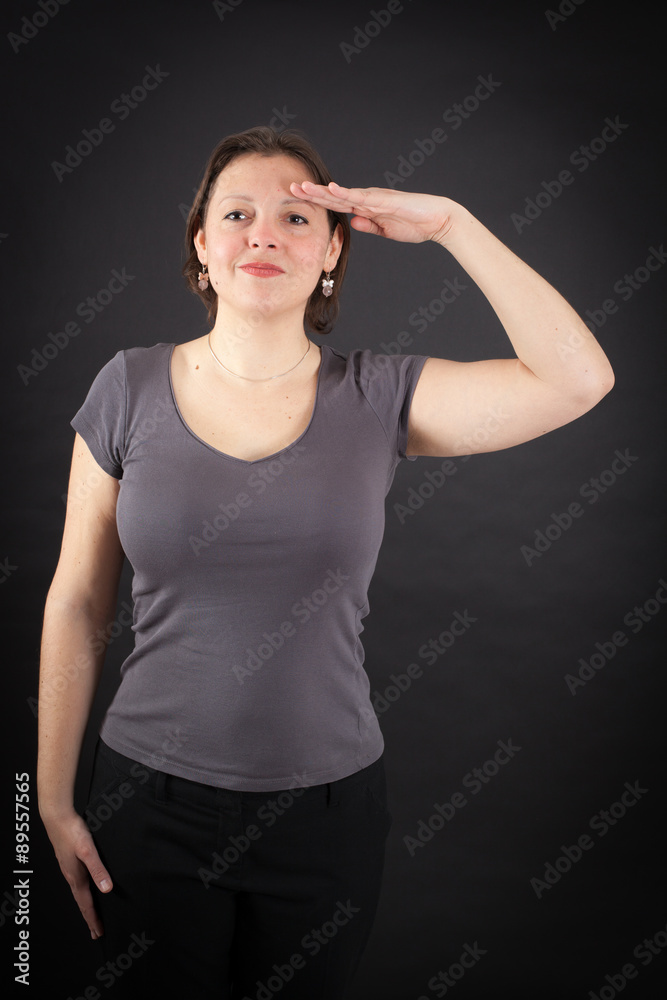 Fototapeta premium Beautiful woman doing different expressions in different sets of clothes: at attention