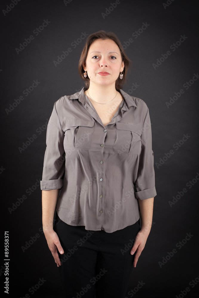 Beautiful woman doing different expressions in different sets of clothes: at attention Beautiful woman doing different expressions in different sets of clothes: at attention