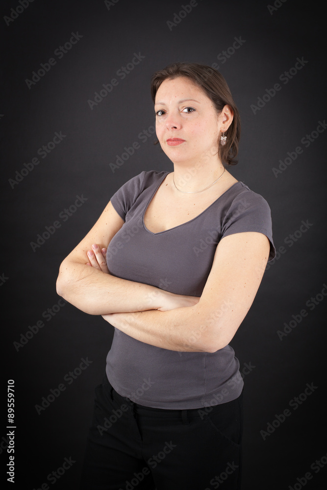 Beautiful woman doing different expressions in different sets of clothes: arms crossed Beautiful woman doing different expressions in different sets of clothes: arms crossed
