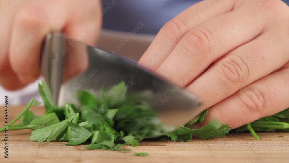 Parsley being chopping (close-up) Parsley being chopping (close-up)