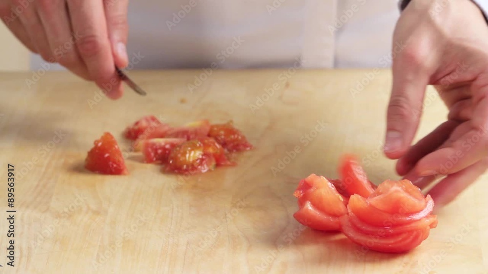 The blanched tomatoes being deseeded The blanched tomatoes being deseeded