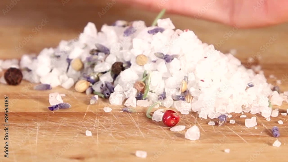 Rock sugar with lavender flowers on a wooden surface