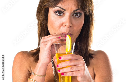 Girl in bikini drinking a cocktail