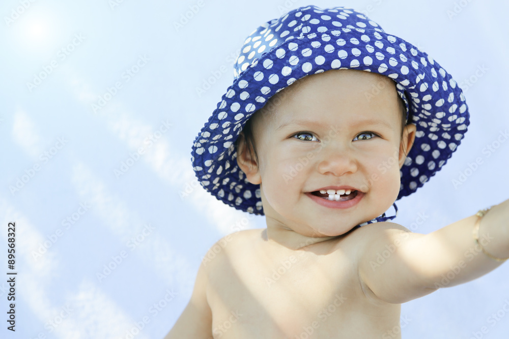 Greece, Kos, smiling baby girl with sun hat Greece, Kos, smiling baby girl with sun hat