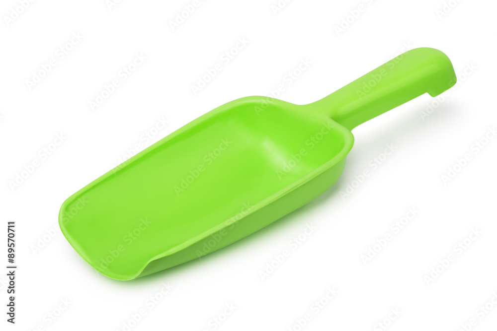 Empty green plastic scoop Empty green plastic scoop