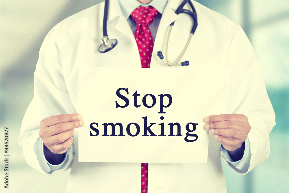 doctor hands holding white card sign with stop smoking text message doctor hands holding white card sign with stop smoking text message