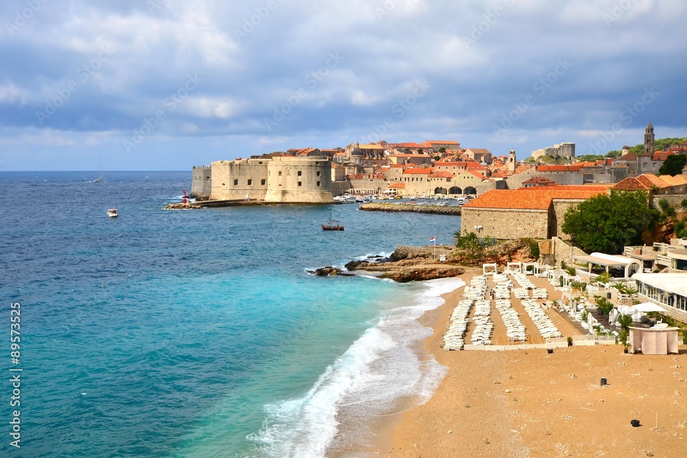 View of old town of Dubrovnik, Croatia over the beaches along the Mediterranean Sea